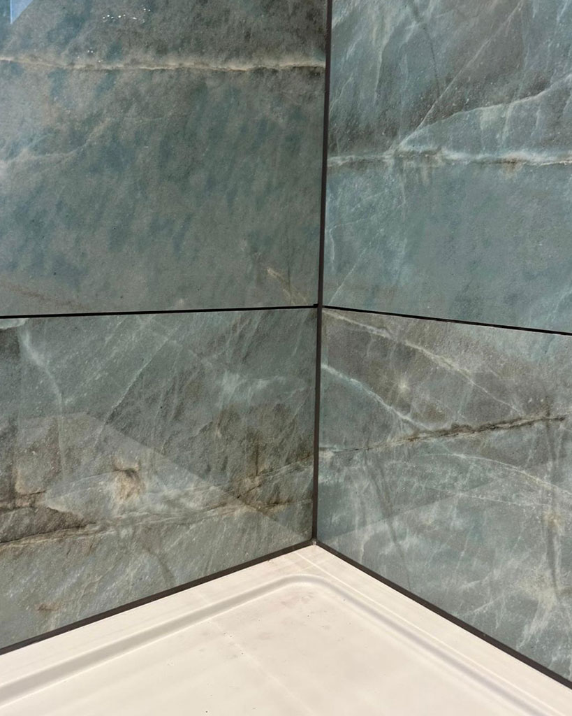Shower tray to tile joint, colour-matched