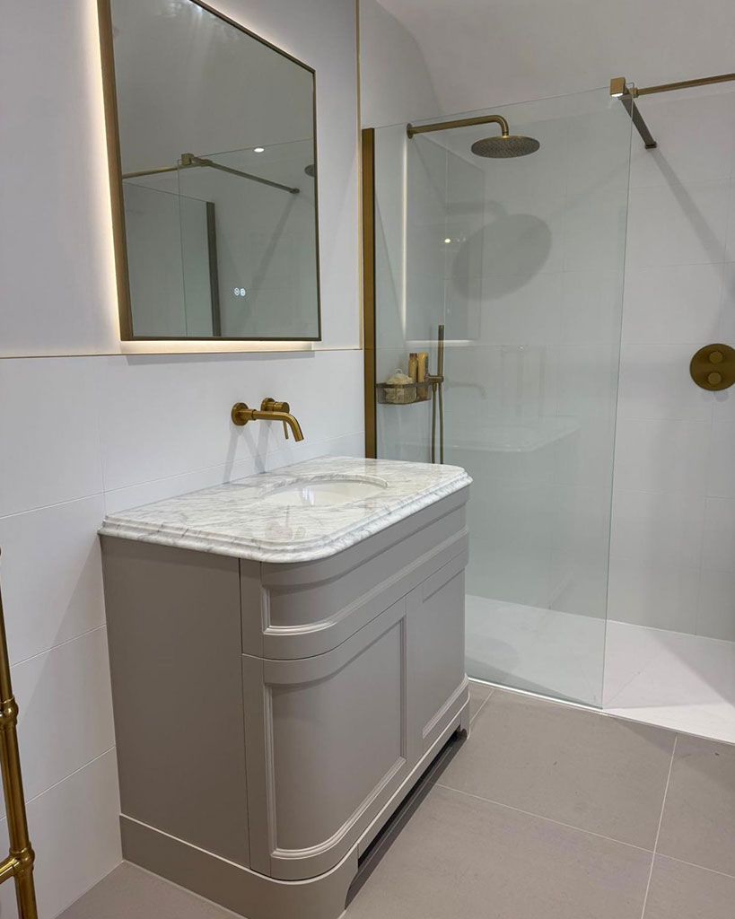 Vanity and walk-in shower, brushed brass