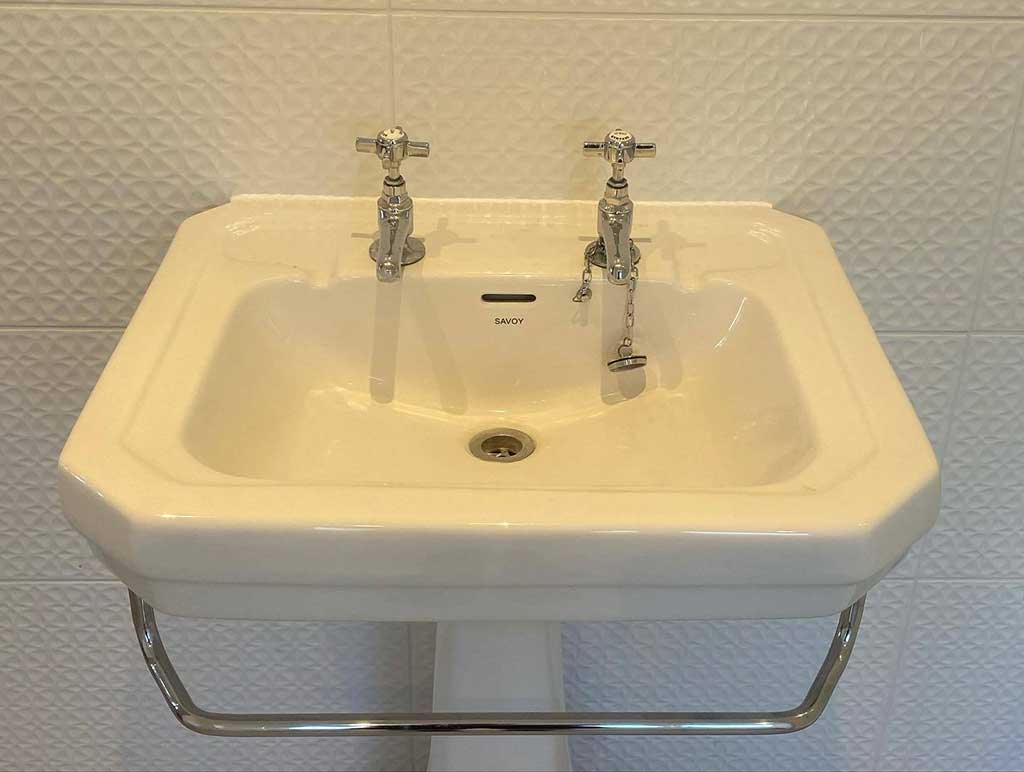 Traditional basin with towel rail
